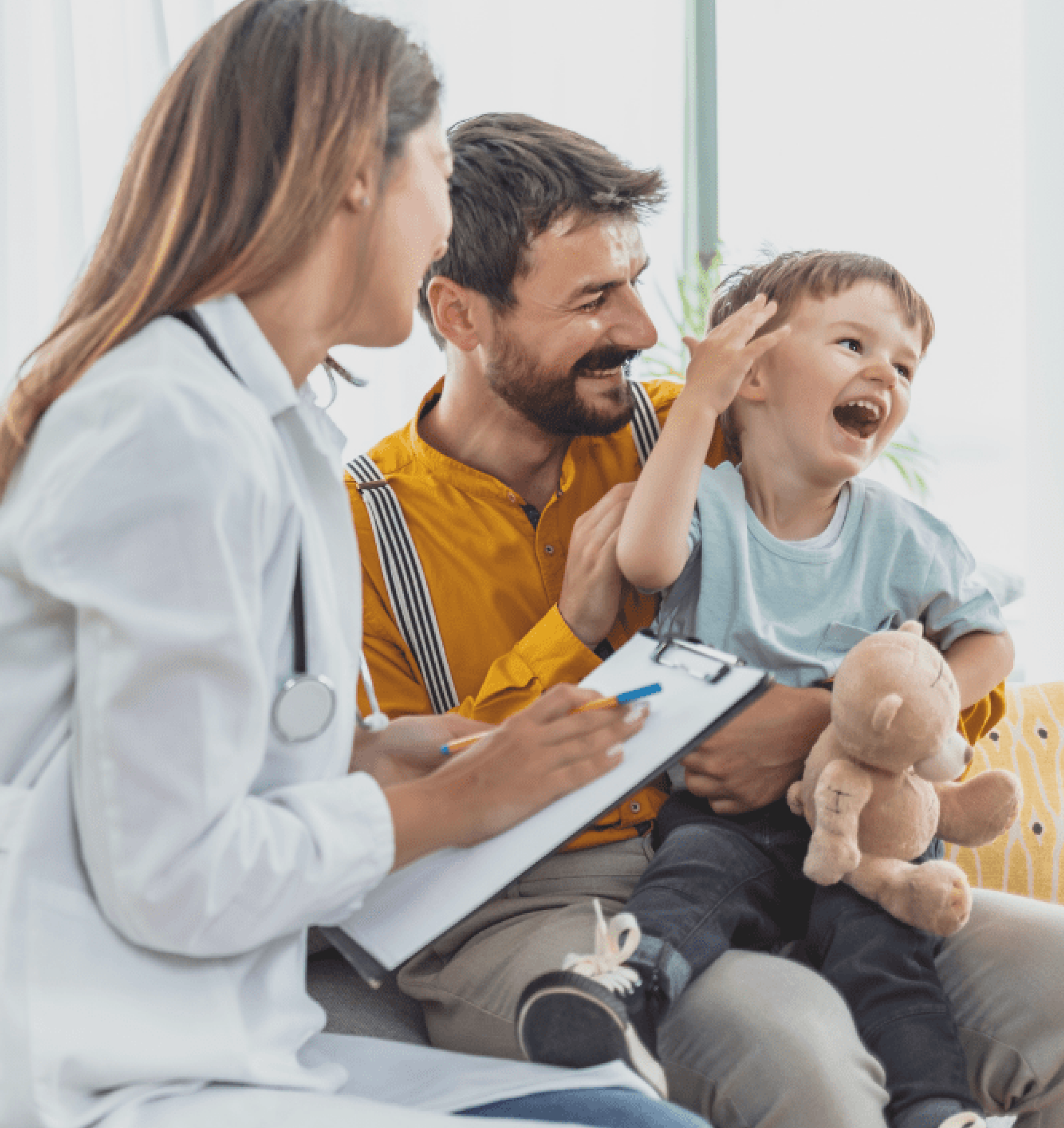 A father and his son talking to a doctor